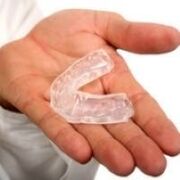 mouth guard to cut teeth, which is a symptom of the presence of parasites